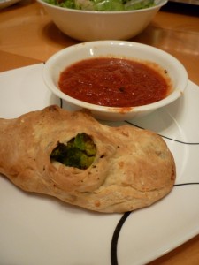Sausage and Broccoli Calzone with spaghetti sauce and salad