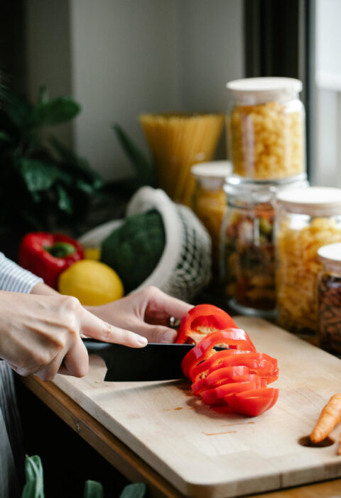 chef knife chopping red pepper