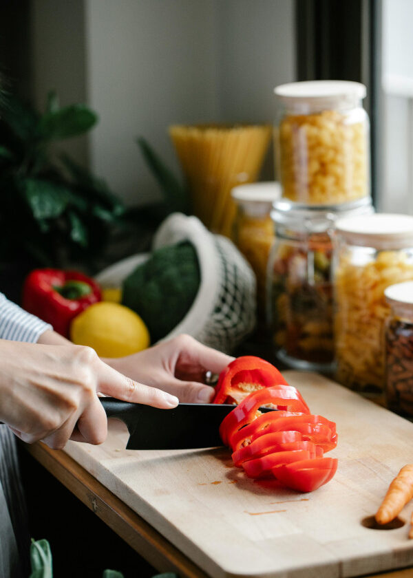 chef knife chopping red pepper